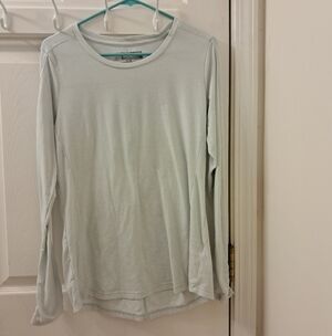 Simm Fishing Products Shirt in light Blue, longer in the back, long sleeves, Med